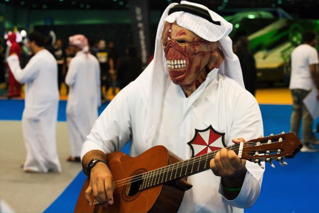 An Emirati dressed as Nemesis from the "Resident Evil" video game series plays a guitar at the Middle East Film &amp; Comic Con in Dubai, United Arab Emirates, Thursday, March 5, 2020. The Middle East Film &amp; Comic Con began Thursday night in Dubai, a city of skyscrapers and nightclubs suddenly subdued by the outbreak of the new coronavirus across the region. (AP Photo/Jon Gambrell) (AP)