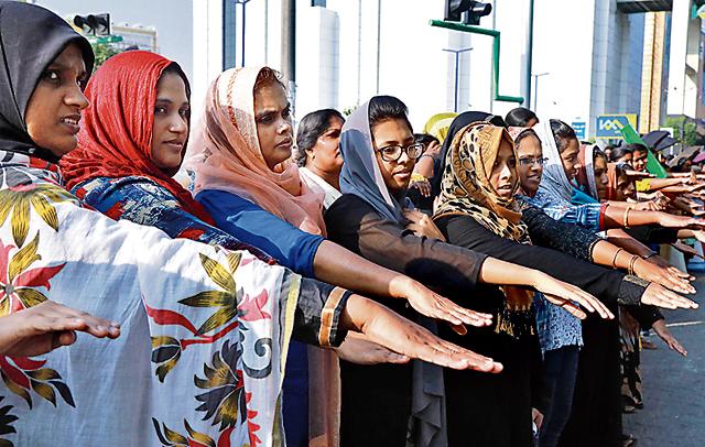 A ‘women’s wall’ protest in Kochi in 2019, in support of a court order overturning a partial ban on women entering the Sabarimala temple. (AFP) A ‘women’s wall’ protest in Kochi in 2019, in support of a court order overturning a partial ban on women entering the Sabarimala temple. (AFP)