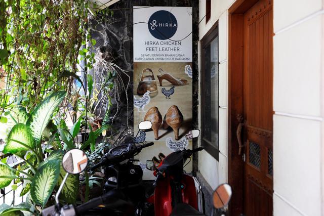 A sign advertising Hirka shoes made from chicken feet leather, is seen outside the company's workshop in Bandung, West Java province, Indonesia. (REUTERS)