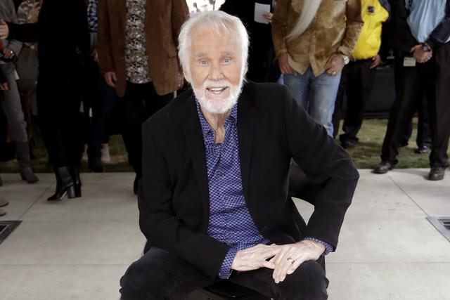 Kenny Rogers poses with his star on the Music City Walk of Fame in Nashville, Tenn. (AP) Kenny Rogers poses with his star on the Music City Walk of Fame in Nashville, Tenn. (AP)
