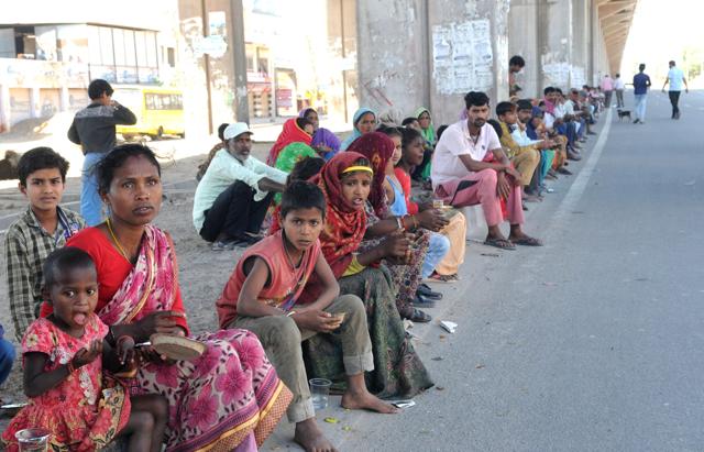 With no roof over their head, the homeless eating food at under bridge Zirakpur- Ambala Highway during lockdown against the COVID-19 corona virus in Chandigarh on Sunday March 29, 2020.Photo by /Hindustan Times (Keshav Singh/HT) With no roof over their head, the homeless eating food at under bridge Zirakpur- Ambala Highway during lockdown against the COVID-19 corona virus in Chandigarh on Sunday March 29, 2020.Photo by /Hindustan Times (Keshav Singh/HT)