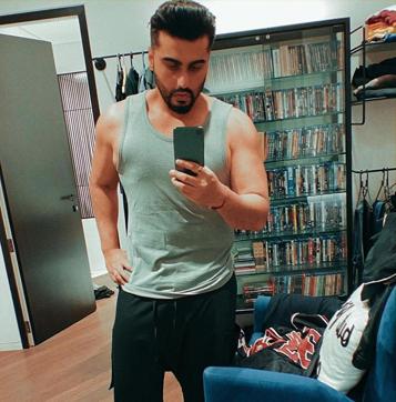 Actor Arjun Kapoor posted a selfie from one of his rooms that shows a showcase behind him full of DVD’s (Photo: Instagram/arjunkapoor) Actor Arjun Kapoor posted a selfie from one of his rooms that shows a showcase behind him full of DVD’s (Photo: Instagram/arjunkapoor)