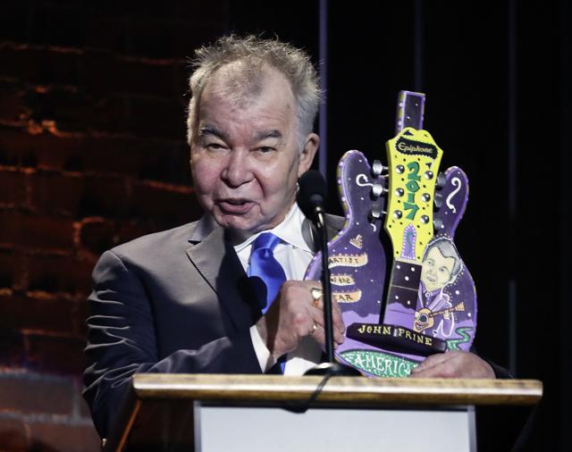 John Prine accepts the artist of the year award during the Americana Honors and Awards. (AP) John Prine accepts the artist of the year award during the Americana Honors and Awards. (AP)