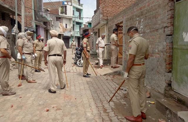 A police team led by ACP (East) Devinder Kumar investigating the matter at Punjabi Bagh area on Tibba road in Ludhiana on Saturday. (Gurpreet Singh/HT) A police team led by ACP (East) Devinder Kumar investigating the matter at Punjabi Bagh area on Tibba road in Ludhiana on Saturday. (Gurpreet Singh/HT)