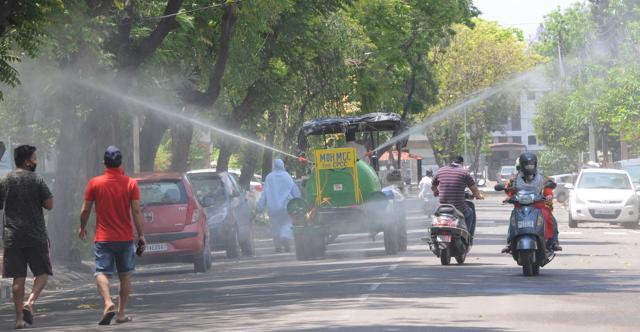 Sanitisation being carried out in Sector 27 in Chandigarh on Thursday. (Keshav Singh/ht) Sanitisation being carried out in Sector 27 in Chandigarh on Thursday. (Keshav Singh/ht)