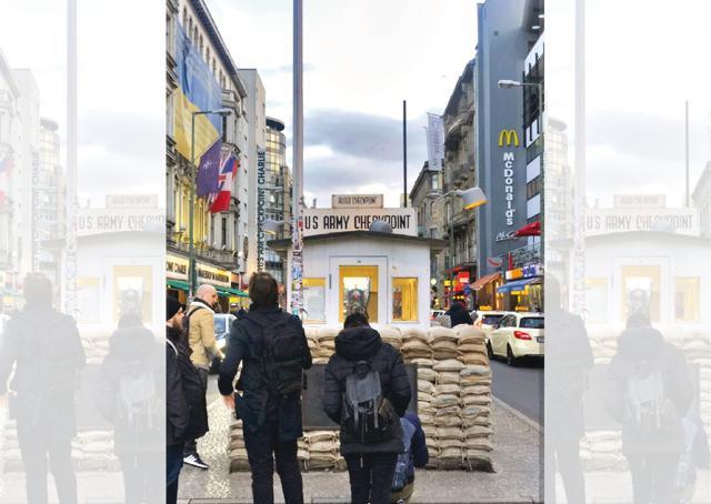 Checkpoint Charlie is the name given to the best-known Berlin Wall crossing between East and West during the cold war Checkpoint Charlie is the name given to the best-known Berlin Wall crossing between East and West during the cold war