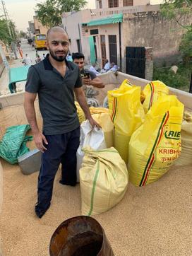 Boxer Amit Panghal while staking wheat in the gunny sacks Boxer Amit Panghal while staking wheat in the gunny sacks