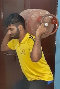 Judoka player Aryaan , Khelo India gold medallist , using a gas cylinder to improve his physical fitness in Ludhiana. (HT Photo) Judoka player Aryaan , Khelo India gold medallist , using a gas cylinder to improve his physical fitness in Ludhiana. (HT Photo)