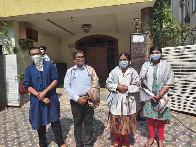 The doctor family standing in front of their house. The doctor family standing in front of their house.