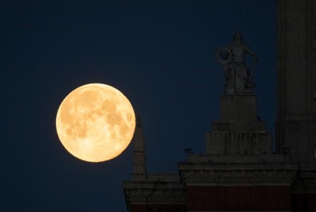The full moon, also known as the Supermoon or Flower Moon, is seen behind the Lomonosov Moscow State University in Moscow, Russia May 8, 2020. REUTERS/Shamil Zhumatov (REUTERS) The full moon, also known as the Supermoon or Flower Moon, is seen behind the Lomonosov Moscow State University in Moscow, Russia May 8, 2020. REUTERS/Shamil Zhumatov (REUTERS)