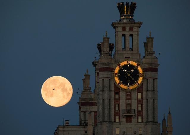A bird flies past the full moon, also known as the Supermoon or Flower Moon, as it is seen behind the Lomonosov Moscow State University in Moscow, Russia May 8, 2020. REUTERS/Shamil Zhumatov TPX IMAGES OF THE DAY (REUTERS) A bird flies past the full moon, also known as the Supermoon or Flower Moon, as it is seen behind the Lomonosov Moscow State University in Moscow, Russia May 8, 2020. REUTERS/Shamil Zhumatov TPX IMAGES OF THE DAY (REUTERS)
