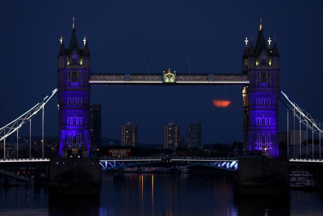The full moon, also known as the Supermoon or Flower Moon, is seen next to Tower Bridge, London, Britain, May 7, 2020. REUTERS/Simon Dawson (REUTERS) The full moon, also known as the Supermoon or Flower Moon, is seen next to Tower Bridge, London, Britain, May 7, 2020. REUTERS/Simon Dawson (REUTERS)