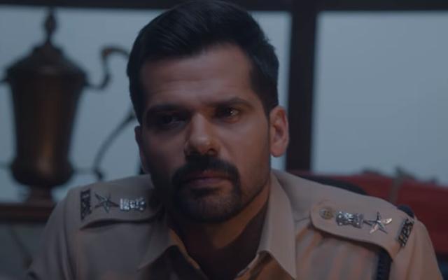 Neil Bhoopalam as a police officer in The Raiker Case. Neil Bhoopalam as a police officer in The Raiker Case.