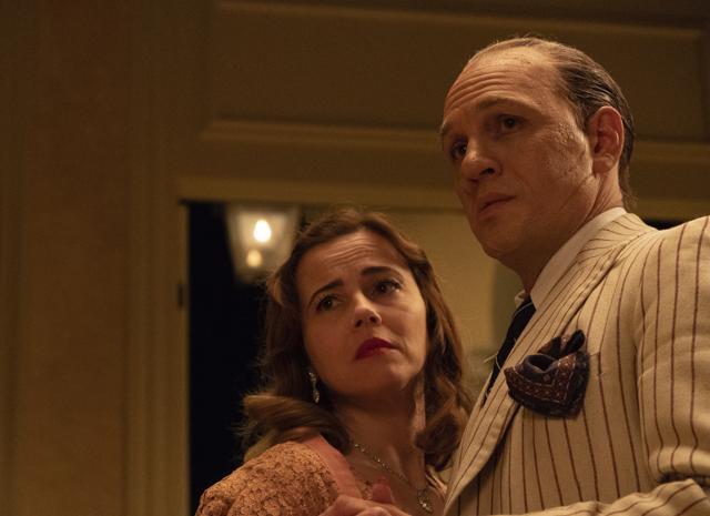 This image released by Vertical Entertainment shows Linda Cardellini, left, and Tom Hardy in a scene from Capone. (AP) This image released by Vertical Entertainment shows Linda Cardellini, left, and Tom Hardy in a scene from Capone. (AP)