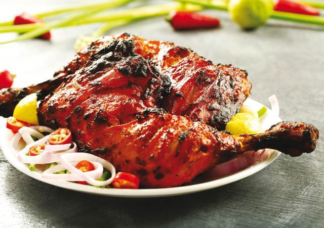 Tandoori Chicken was created in Peshawar in the 1930s by an innovative cook who thought he could use the tandoor for more than just cooking bread (Shutterstock) Tandoori Chicken was created in Peshawar in the 1930s by an innovative cook who thought he could use the tandoor for more than just cooking bread (Shutterstock)