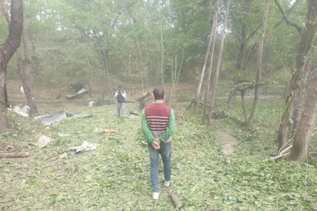 Police officers collecting the debris off the car bomb after the vehicle was detonated by bomb experts (Sourced/J&K Police) Police officers collecting the debris off the car bomb after the vehicle was detonated by bomb experts (Sourced/J&K Police)