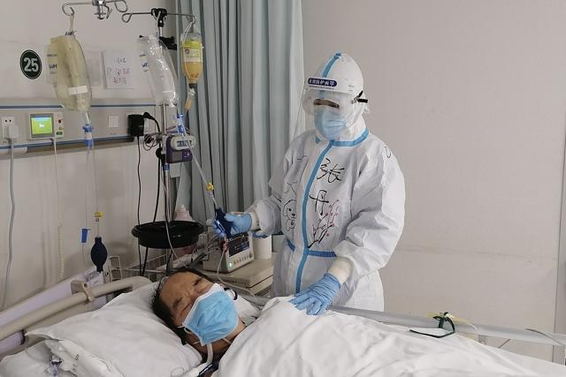 In the image, Chinese nurse Zhang Dan looks after a patient being treated for COVID-19. (AP) In the image, Chinese nurse Zhang Dan looks after a patient being treated for COVID-19. (AP)