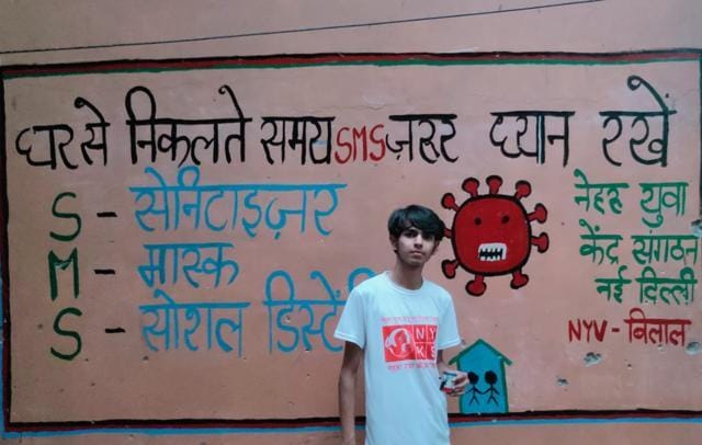 A youth volunteer painting a wall in New Delhi district. A youth volunteer painting a wall in New Delhi district.