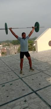 Young thrower Prateek doing weight training on the roof top of his house in Jaunpur. (Special Arrangement) Young thrower Prateek doing weight training on the roof top of his house in Jaunpur. (Special Arrangement)