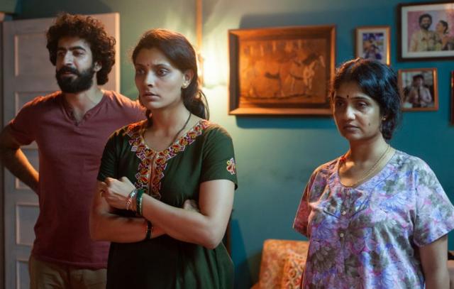 Roshan Mathew, Saiyami Kher and Amruta Subhash in a still from Choked. (Netflix)