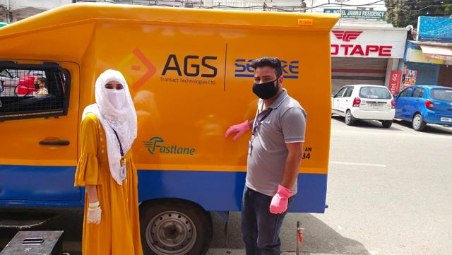 ATM officer Sayeeda Begum and a colleague on their way to refill the ATMs in Jammu. (HT PHOTO)