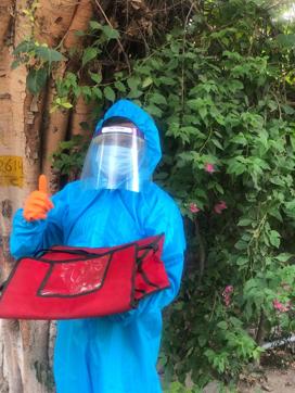 Delivery boys at Instapizza have been provided PPE suits. Delivery boys at Instapizza have been provided PPE suits.