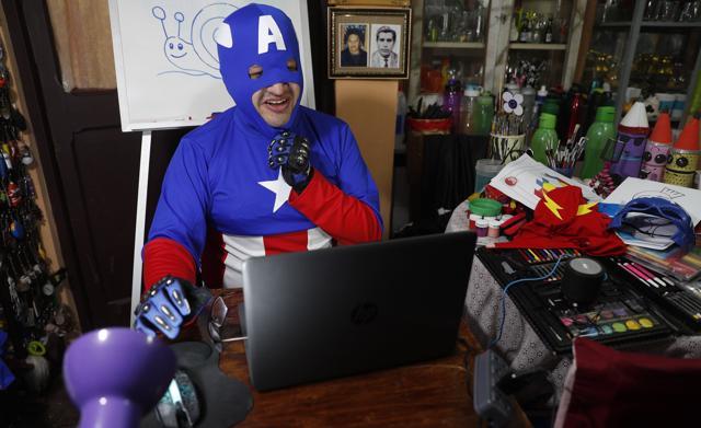 Art teacher Jorge Manolo Villarroel, wearing a Captain America costume, teaches an online class from his home, amid the new coronavirus pandemic in La Paz, Bolivia. (AP) Art teacher Jorge Manolo Villarroel, wearing a Captain America costume, teaches an online class from his home, amid the new coronavirus pandemic in La Paz, Bolivia. (AP)