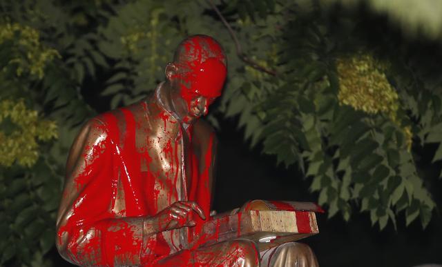 A statue of Indro Montanelli, a one-time fascist who became and icon of Italy's right and a leading name in Italian journalism, is covered with red paint during a Black Lives Matter protest, in Milan, Italy, Saturday, June 13, 2020. Protesters want to remove the statue. (AP Photo/Antonio Calanni) (AP) A statue of Indro Montanelli, a one-time fascist who became and icon of Italy's right and a leading name in Italian journalism, is covered with red paint during a Black Lives Matter protest, in Milan, Italy, Saturday, June 13, 2020. Protesters want to remove the statue. (AP Photo/Antonio Calanni) (AP)