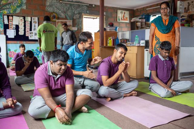 Autistic people perform morning prayers and yoga at ALFAA (Assisted Living for Autistic Adults), KR Puram in Bengaluru, India. (Photo: Vivek M/HT (For representational purpose only))