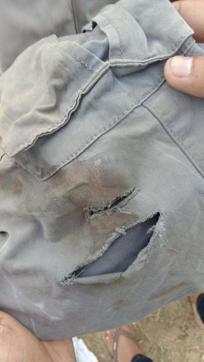 A family member shows Mandeep’s clothes recovered near the canal. (HT Photo)