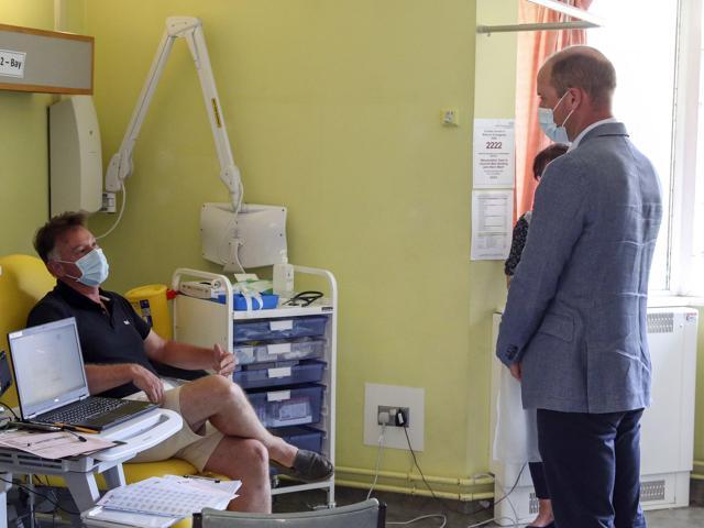 Britain's Prince William talks to a patient participating in the Covid-19 vaccine trial during a visit to the manufacturing laboratory where a vaccine has been produced, at the Oxford Vaccine Group's facility at the Churchill Hospital in Oxford, England, Wednesday, June 24, 2020. (AP) Britain's Prince William talks to a patient participating in the Covid-19 vaccine trial during a visit to the manufacturing laboratory where a vaccine has been produced, at the Oxford Vaccine Group's facility at the Churchill Hospital in Oxford, England, Wednesday, June 24, 2020. (AP)