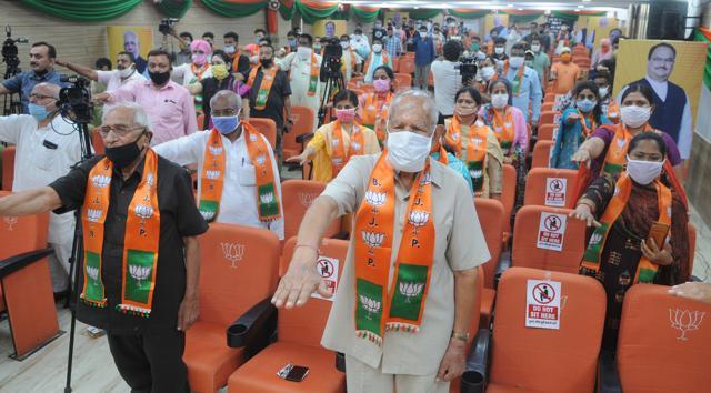 BJP members taking part in the virtual rally. (Keshav Singh/HT)