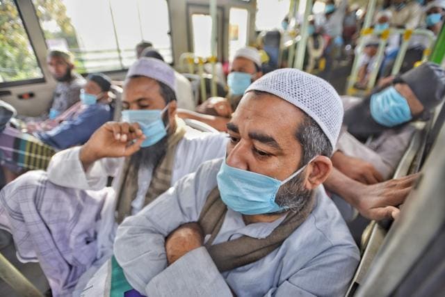 People who took part in a Tablighi Jamaat function at Nizamuddin in New Delhi in March 2020 aboard buses taking them to a quarantine facility on March 31. (Biplov Bhuyan/Hindustan Times) People who took part in a Tablighi Jamaat function at Nizamuddin in New Delhi in March 2020 aboard buses taking them to a quarantine facility on March 31. (Biplov Bhuyan/Hindustan Times)