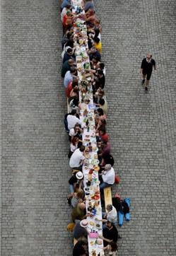Residents dine at a 500-metre-long table spanning across the length of the medieval Charles Bridge as restrictions ease following the coronavirus disease (COVID-19) outbreak, in Prague, Czech Republic June 30, 2020. (REUTERS)