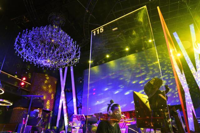 A DJ is seen behind a plastic barrier at the Sherbet club ahead of bars and night clubs reopening nationwide after the Thai government extended an emergency decree until the end of July in a bid to avoid the risk of a second wave of the spread of the coronavirus disease (COVID-19) in Bangkok, Thailand, June 30, 2020. (REUTERS) A DJ is seen behind a plastic barrier at the Sherbet club ahead of bars and night clubs reopening nationwide after the Thai government extended an emergency decree until the end of July in a bid to avoid the risk of a second wave of the spread of the coronavirus disease (COVID-19) in Bangkok, Thailand, June 30, 2020. (REUTERS)