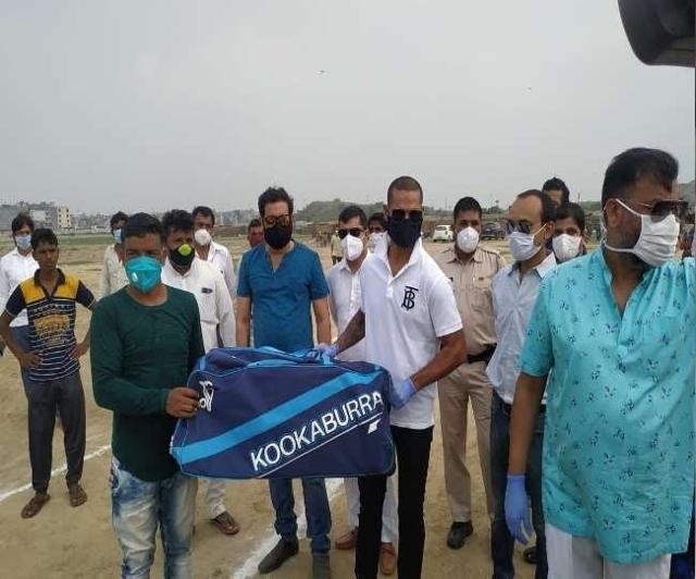 Shikhar Dhawan distributed cricket kits at the refugee colony. Shikhar Dhawan distributed cricket kits at the refugee colony.