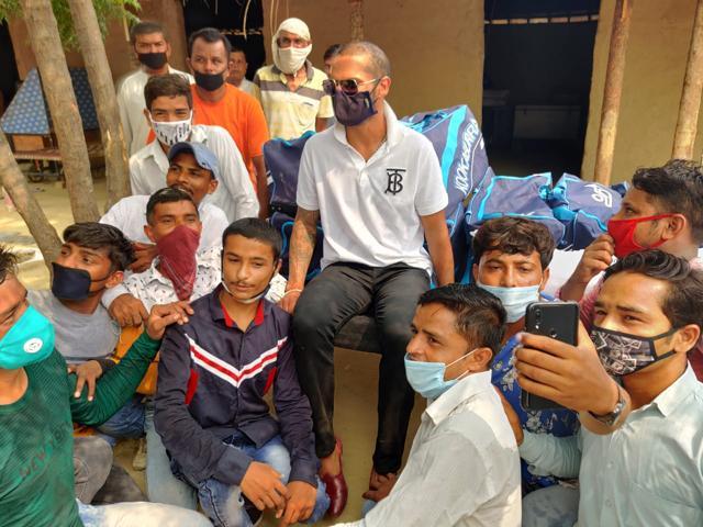 Shikhar Dhawan interacted with the refugees and also took selfies with them. Shikhar Dhawan interacted with the refugees and also took selfies with them.