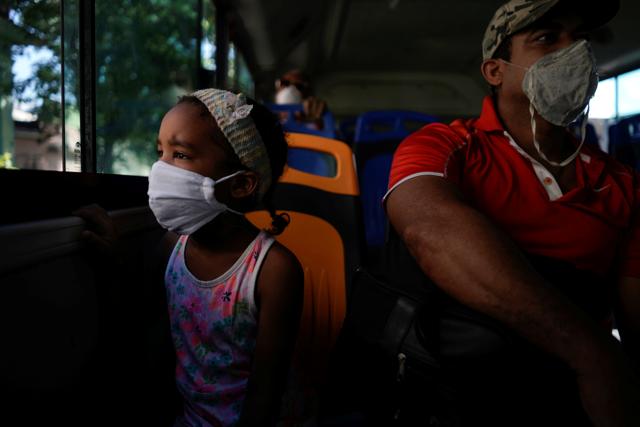 Jenifer Reyes, 5, sits in a bus beside her father amid concerns about the spread of the coronavirus disease (COVID-19), in Havana, Cuba, July 3, 2020. (REUTERS) Jenifer Reyes, 5, sits in a bus beside her father amid concerns about the spread of the coronavirus disease (COVID-19), in Havana, Cuba, July 3, 2020. (REUTERS)