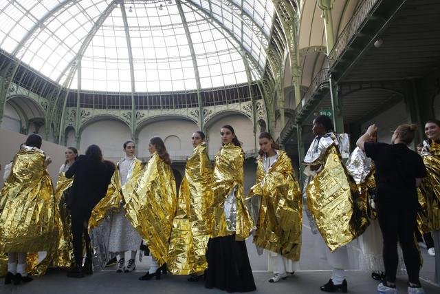 Models wait before the presentation of Chanel Haute Couture Spring/Summer 2020 fashion collection, in Paris. (AP Photo/Thibault Camus, File) Models wait before the presentation of Chanel Haute Couture Spring/Summer 2020 fashion collection, in Paris. (AP Photo/Thibault Camus, File)