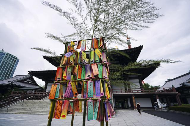 Paper strips with visitors' wishes written on them are decorated on a bamboo branch for the Star Festival or "tanabata" at a temple in Tokyo. (AP Photo/Eugene Hoshiko) Paper strips with visitors' wishes written on them are decorated on a bamboo branch for the Star Festival or "tanabata" at a temple in Tokyo. (AP Photo/Eugene Hoshiko)