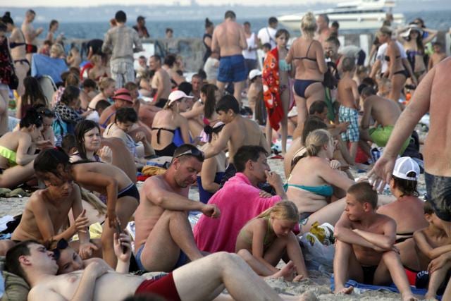 People enjoy the beach in the Black Sea in Odessa, Ukraine, Sunday, July 5, 2020. (AP)