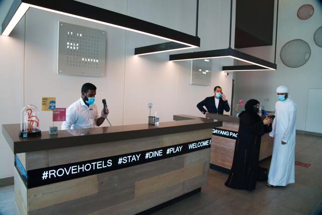 The front desk staff wearing masks due to the coronavirus pandemic help customers at the Rove City Centre Hotel in Dubai, United Arab Emirates, Monday, July 6, 2020. Dubai reopened for tourists Tuesday amid the coronavirus pandemic, hoping to reinvigorate a vital industry for this city-state before its crucial winter tourist season. (AP) The front desk staff wearing masks due to the coronavirus pandemic help customers at the Rove City Centre Hotel in Dubai, United Arab Emirates, Monday, July 6, 2020. Dubai reopened for tourists Tuesday amid the coronavirus pandemic, hoping to reinvigorate a vital industry for this city-state before its crucial winter tourist season. (AP)