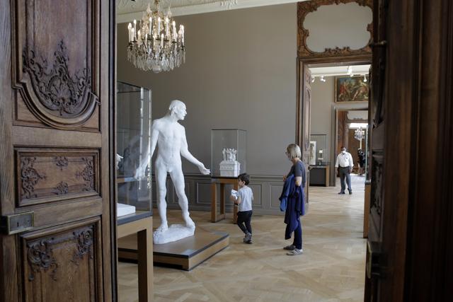 Travelers visit the Rodin museum in Paris Tuesday, July 7, 2020. The Musee Rodin is reopening this morning albeit with a worrying loss of visitors and income caused by the four-months closure. (AP) Travelers visit the Rodin museum in Paris Tuesday, July 7, 2020. The Musee Rodin is reopening this morning albeit with a worrying loss of visitors and income caused by the four-months closure. (AP)