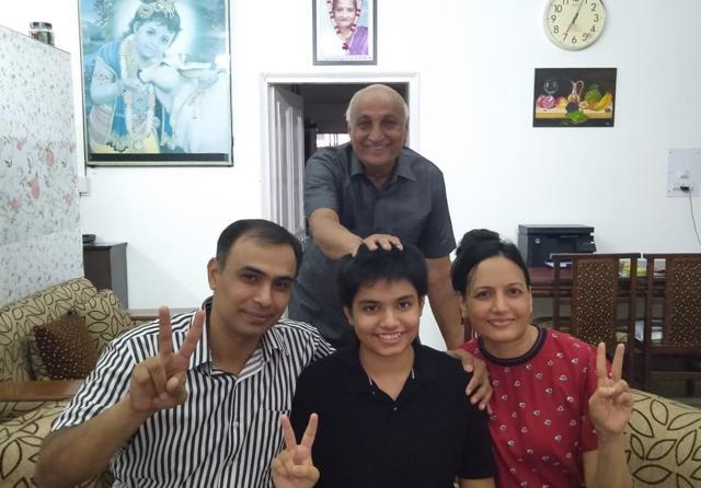 Viha Singla, who also topped the tricity, with her family on Friday. (HT Photo) Viha Singla, who also topped the tricity, with her family on Friday. (HT Photo)
