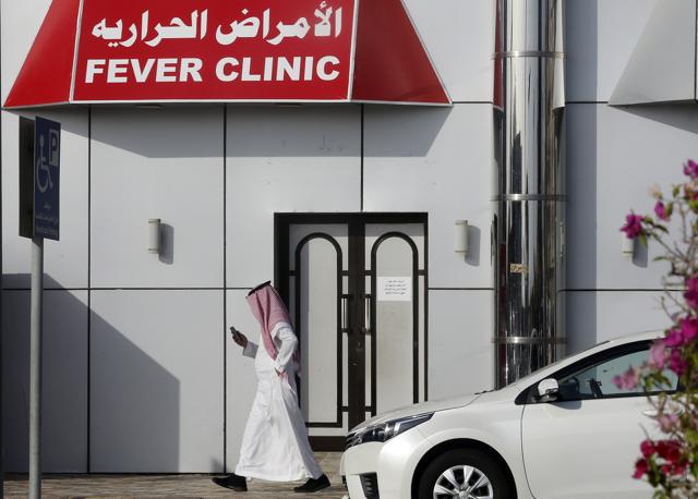 A Saudi man walks in front of a fever clinic serving individuals showing COVID-19 symptoms in Jiddah, Saudi Arabia, Thursday, July 9, 2020. (AP) A Saudi man walks in front of a fever clinic serving individuals showing COVID-19 symptoms in Jiddah, Saudi Arabia, Thursday, July 9, 2020. (AP)