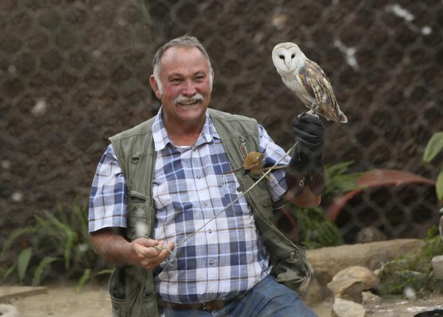 Gary Strafford, a Zimbabwean falconer, holds an owl inside one of the cages at his bird sanctuary, Kuimba Shiri, near Harare, Zimbabwe, Wednesday, June, 17, 2020. (AP) Gary Strafford, a Zimbabwean falconer, holds an owl inside one of the cages at his bird sanctuary, Kuimba Shiri, near Harare, Zimbabwe, Wednesday, June, 17, 2020. (AP)