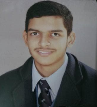 Khush Harman Singh Sekhon of Doon International School topped the district in the non-medical stream with 96.4% (HT photo)