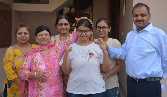 Medical stream topper Shruti Goyal with her family members (Sant Arora/HT) Medical stream topper Shruti Goyal with her family members (Sant Arora/HT)