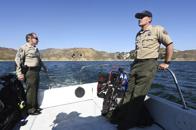 Sgt. Tim Lohman, left, and Capt. Jeremy Paris of the Ventura County Sheriff's Department, continue the search for missing actress Naya Rivera at Lake Piru, Friday. (AP) Sgt. Tim Lohman, left, and Capt. Jeremy Paris of the Ventura County Sheriff's Department, continue the search for missing actress Naya Rivera at Lake Piru, Friday. (AP)