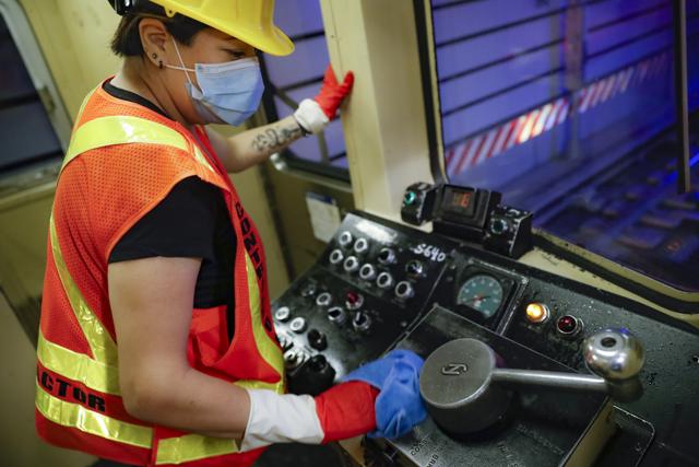 A contractor cleans a subway car at the 96th Street station to control the spread of COVID-19, Thursday, July 2, 2020, in New York. (AP) A contractor cleans a subway car at the 96th Street station to control the spread of COVID-19, Thursday, July 2, 2020, in New York. (AP)